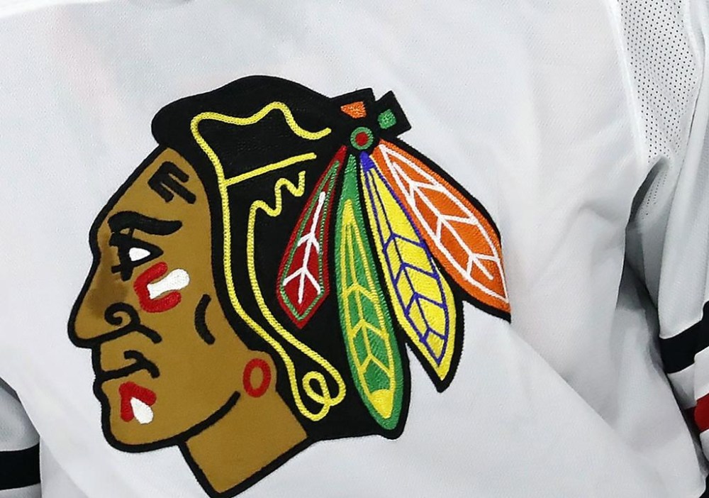 FILE - The Chicago Blackhawks logo adorns a jersey in Raleigh, N.C., May 3, 2021. A consultant the Chicago Blackhawks hired to improve relationships with American Indian tribes filed a lawsuit Tuesday, May 14, 2024, accusing the team, its charity foundation and its CEO of fraud, breach of contract and sexual harassment. (AP Photo/Karl B DeBlaker, File)