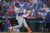 New York Mets' Mark Vientos hits a run-scoring double against Philadelphia Phillies pitcher Ranger Suarez during the first inning of a baseball game, Wednesday, May 15, 2024, in Philadelphia. (AP Photo/Matt Slocum)