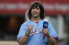 Rhett Miller reacts to applause after singing the national anthem before a baseball game between the Cleveland Guardians and Texas Rangers in Arlington, Texas, Wednesday, May 15, 2024. (AP Photo/LM Otero)