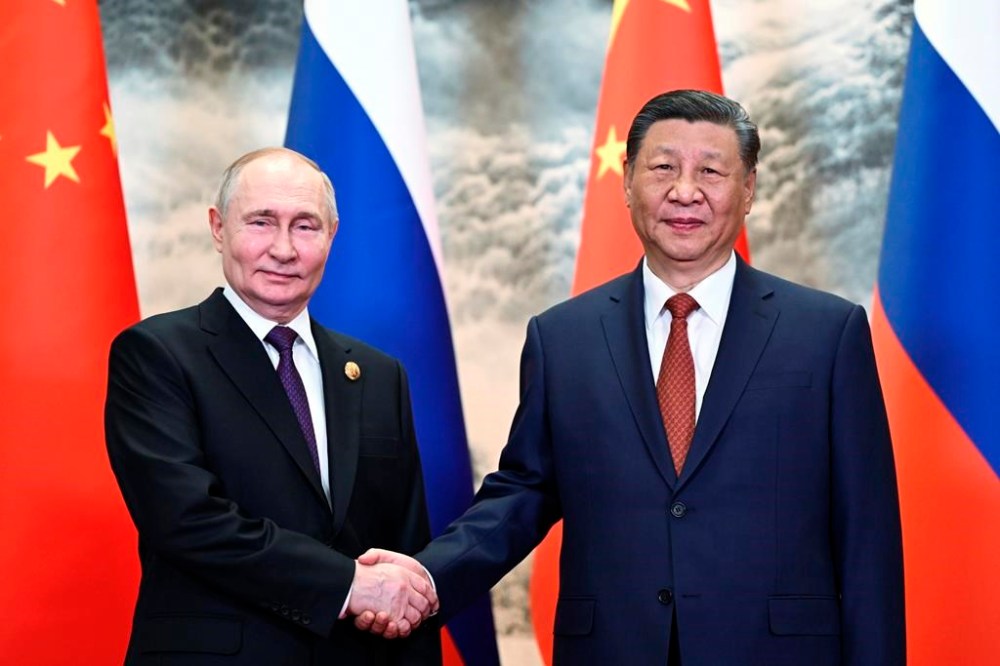 Chinese President Xi Jinping, right, and Russian President Vladimir Putin pose for a photo prior to their talks in Beijing, China, on Thursday, May 16, 2024. (Sergei Guneyev, Sputnik, Kremlin Pool Photo via AP)