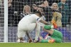 Tottenham's Cristian Romero, left, comforts Manchester City's goalkeeper Ederson during the English Premier League soccer match between Tottenham Hotspur and Manchester City at Tottenham Hotspur Stadium in London, Tuesday, May 14, 2024.(AP Photo/Kin Cheung)