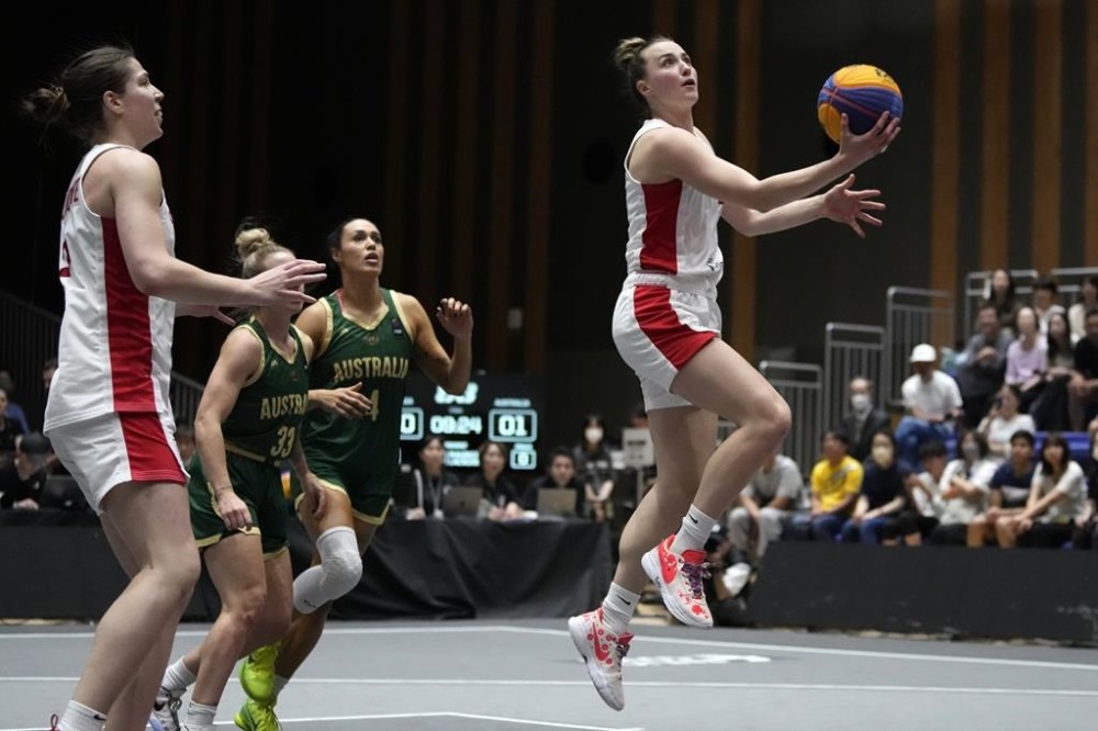 The Canadian women's 3x3 basketball team went undefeated Thursday as play opened at an Olympic qualifying tournament. Canada's Paige Crozon aims to score against against of Australia during a women's 3x3 basketball final of FIBA Universality Olympic Qualifying Tournament, in Utsunomiya, Japan, Sunday, May 5, 2024. THE CANADIAN PRESS/AP-Shuji Kajiyama
