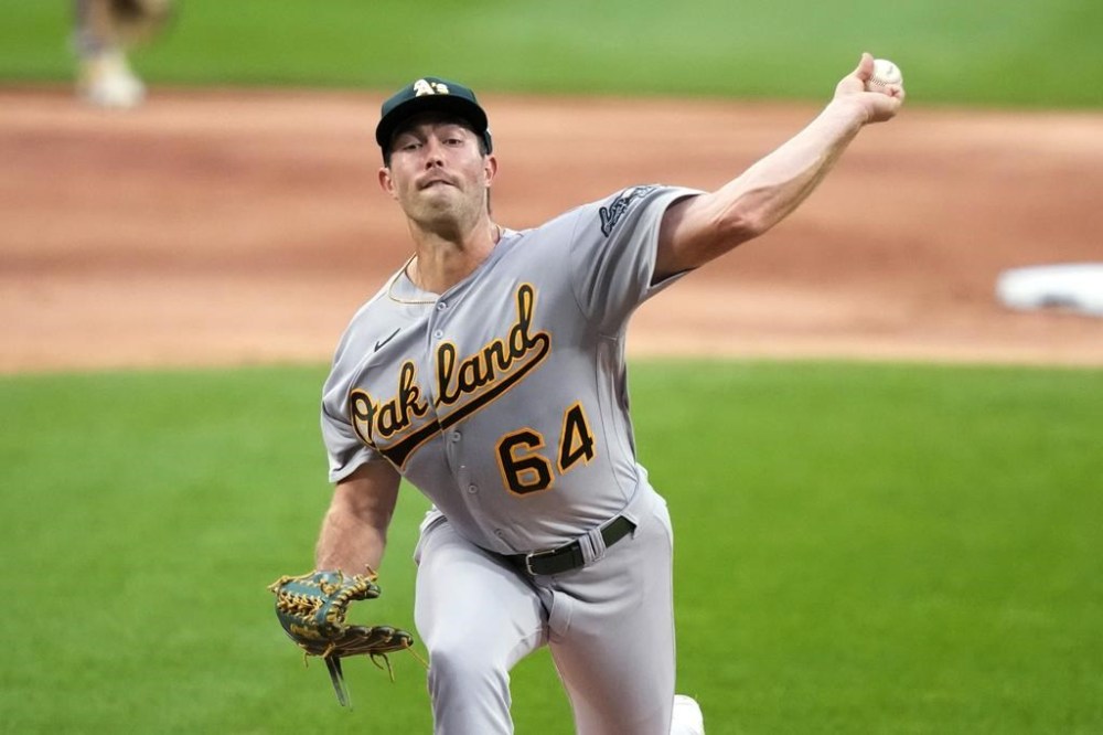 FILE - Oakland Athletics starting pitcher Ken Waldichuk delivers during the first inning of the team's baseball game against the Chicago White Sox on Aug. 24, 2023, in Chicago. Waldichuk had reconstructive surgery on his troublesome pitching elbow and will be sidelined all season, another tough injury blow for the pitcher this past year. (AP Photo/Charles Rex Arbogast, File)