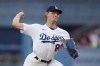 FILE - Los Angeles Dodgers starting pitcher Emmet Sheehan throws to an Atlanta Braves batter during the first inning of a baseball game Sept. 2, 2023, in Los Angeles. Sheehan has had season-ending Tommy John surgery on his right elbow. The team announced Thursday, May 16, that the 24-year-old right-hander underwent the procedure Wednesday in Los Angeles. (AP Photo/Jae C. Hong, File)