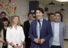 Prime Minister Justin Trudeau speaks as Minister of Families, Children and Social Development, Jenna Sudds, left, and MP Serge Cormier look on during an announcement at Marguerite-Bourgeoys School in Caraquet, N.B., Thursday, May 16, 2024. THE CANADIAN PRESS/Ron Ward