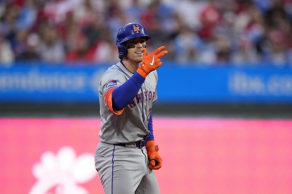New York Mets' Brett Baty reacts after hitting a run-scoring double against Philadelphia Phillies pitcher Taijuan Walker during the second inning of a baseball game, Thursday, May 16, 2024, in Philadelphia. (AP Photo/Matt Slocum)