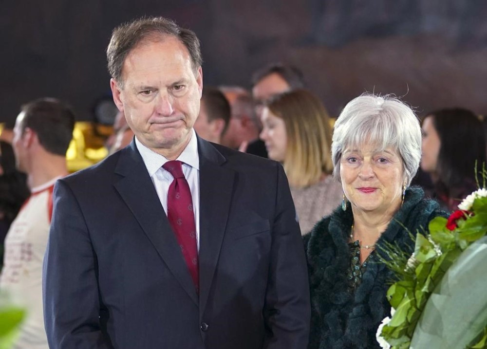 FILE - Supreme Court Justice Samuel Alito Jr., left, and his wife Martha-Ann Alito, pay their respects at the casket of Reverend Billy Graham at the Rotunda of the U.S. Capitol Building in Washington, Feb. 28, 2018. An upside-down American flag was displayed outside of Alito's home Jan. 17, 2021, days after former President Donald Trump supporters stormed the U.S. Capitol, The New York Times reports. It's a symbol associated with Trump's false claims of election fraud.