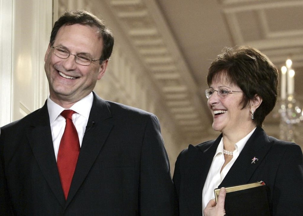 FILE - Supreme Court Justice Samuel Alito, left, and Martha-Ann Alito attend his ceremonial swearing-in at the White House Feb. 1, 2006, in Washington. An upside-down American flag was displayed outside of Alito's home Jan. 17, 2021, days after former President Donald Trump supporters stormed the U.S. Capitol, The New York Times reports. It's a symbol associated with Trump's false claims of election fraud.