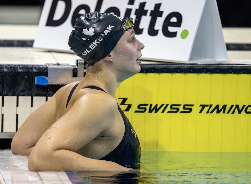 Penny Oleksiak leans on the side of the pool following the women's 200m freestyle at the Canadian Olympic Swim Trials in Toronto on Tuesday May 14, 2024. THE CANADIAN PRESS/Frank Gunn
