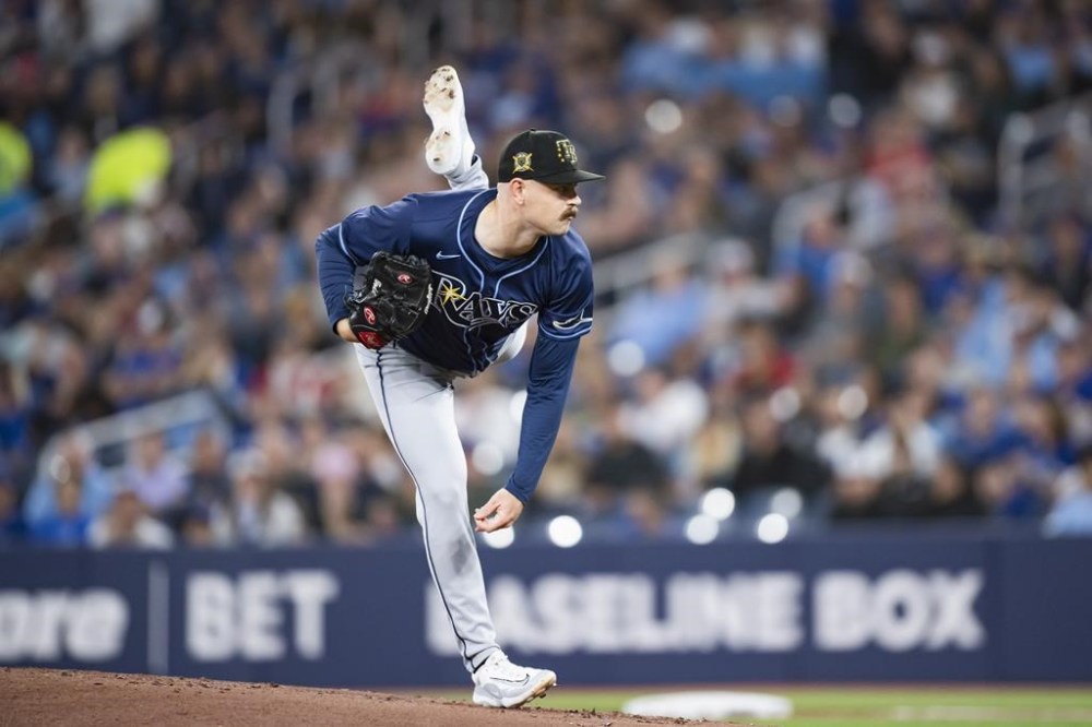 Tampa Bay Rays starting pitcher Tyler Alexander (14) throws the ball during first inning MLB baseball action against the Toronto Blue Jays in Toronto, Friday, May 17, 2024. THE CANADIAN PRESS/Chris Katsarov