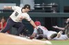 Los Angeles Angels' Kevin Pillar (12) steals third base against Texas Rangers third base Josh Smith (8) during the third inning of a baseball game in Arlington, Texas, Friday, May 17, 2024. (AP Photo/LM Otero)
