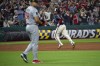 Cleveland Guardians' Jose Ramirez, back right, rounds the bases after hitting a solo home run off Minnesota Twins relief pitcher Jhoan Duran, front left, during the eighth inning of a baseball game in Cleveland, Friday, May 17, 2024. (AP Photo/Phil Long)