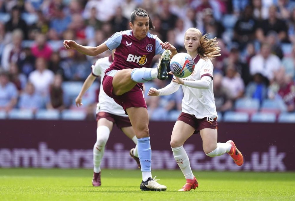 Aston Villa's Kenza Dali, left, and Manchester City's Jess Park battle for the ball during the Barclays Women's Super League match at Villa Park, Birmingham, Britain, Saturday May 18, 2024. (Mike Egerton/PA via AP)