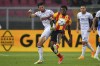 Lecce's Patrick Dorgu, right, and Atalanta's Hans Hateboer during the Serie A soccer match between US Lecce and Atalanta BC at the Via del Mare Stadium, Saturday, May 18, 2024, in Lecce, Italy. (Giovanni Evangelista/LaPresse via AP)