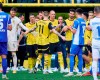 Dortmund's Marcus Reus, centre, is substituted and received an applause from all the players during the Bundesliga soccer match between Borussia Dortmund and SV Darmstadt 98 at the Signal Iduna Park in Dortmund, Germany, Saturday May 18, 2024. This is the last match of Marco Reus with Borussia Dortmund. (Bernd Thissen/dpa via AP)
