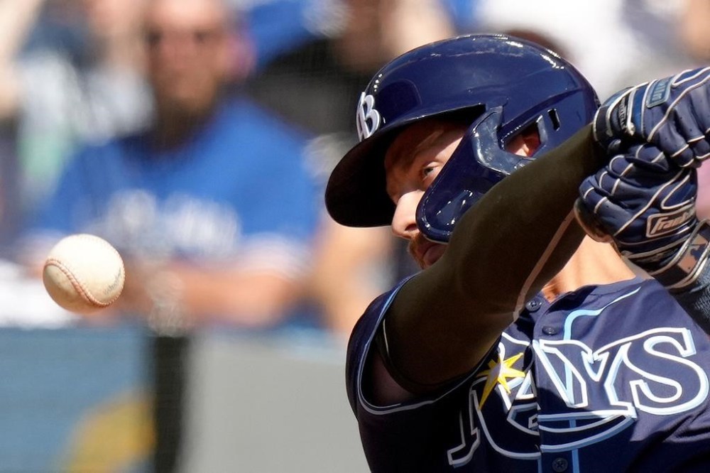 Tampa Bay Rays outfielder Jonny DeLuca (21) has his eye on the ball during fourth inning MLB baseball action against the Toronto Blue Jays, in Toronto, Saturday, May 18, 2024. DeLuca hit a foul. THE CANADIAN PRESS/Chris Young