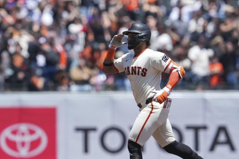 San Francisco Giants' Luis Matos runs the bases after hitting a three-run home run against Colorado Rockies pitcher Ty Blach during the first inning of a baseball game Saturday, May 18, 2024, in San Francisco. (AP Photo/Godofredo A. Vásquez)