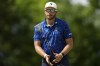 Dean Burmester, of South Africa, reacts after missing a putt on the 10th hole during the third round of the PGA Championship golf tournament at the Valhalla Golf Club, Saturday, May 18, 2024, in Louisville, Ky. (AP Photo/Sue Ogrocki)