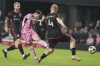 Inter Miami forward Lionel Messi, center attempts a shot on the goal past D.C. United midfielder Matti Peltola (4) during the second half of an MLS soccer match, Saturday, May 18, 2024, in Fort Lauderdale, Fla. (AP Photo/Lynne Sladky)