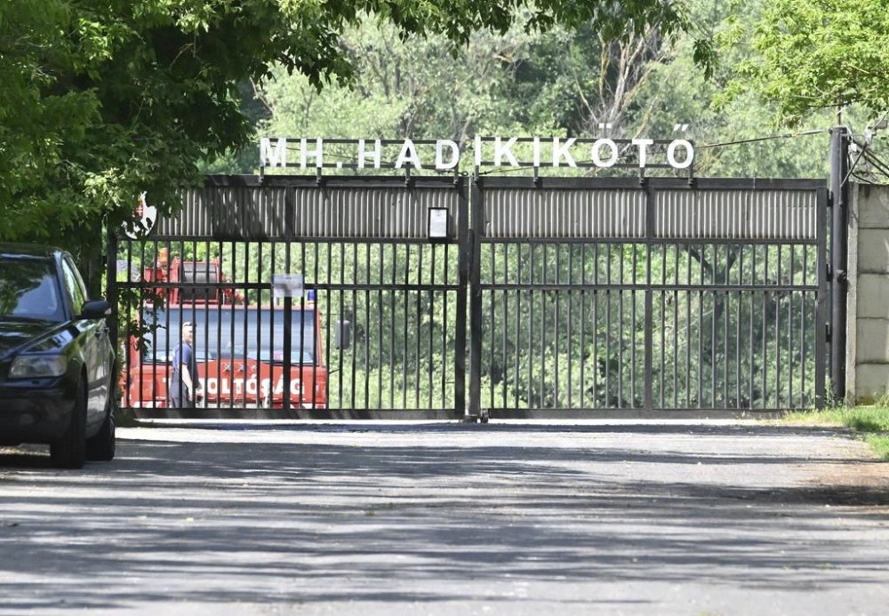 A car of the diving service of the fire brigade is parked behind the closed gate of a military port where rescuers search for victims of a boat accident in Northern Budapest, Hungary, Sunday, May 19, 2024. Last night a motor boat with eight persons onboard crashed with a large river cruise ship on River Danube, north of Budapest. One person has been rescued with serious injuries, two bodies have been recovered and five passengers of the boat are looked for. (Peter Lakatos/MTI via AP)