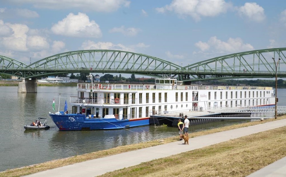 Police investigators examine the bow of a river cruise ship after an incident, in Komarom, Hungary, Sunday, May 19, 2024. Police say two people have died and five are missing following a boat collision on the Danube River in Hungary. Hungarian police received a report late Saturday night that a man had been found with a head injury on the shore of the Danube near the town of Veroce, around 30 miles (50 kilometers) north of the capital, Budapest. (Csaba Krizsan/MTI via AP)