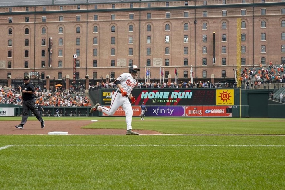 Baltimore Orioles' Gunnar Henderson, center, runs the bases after hitting a home run against the Seattle Mariners during the first inning of a baseball game at Oriole Park at Camden Yards, Sunday, May 19, 2024, in Baltimore. (AP Photo/Jess Rapfogel)
