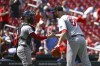 Boston Red Sox catcher Connor Wong, left, celebrates with teammate Chris Martin, right, after beating the St. Louis Cardinals after a baseball game, Sunday, May 19, 2024, in St. Louis. (AP Photo/Joe Puetz)