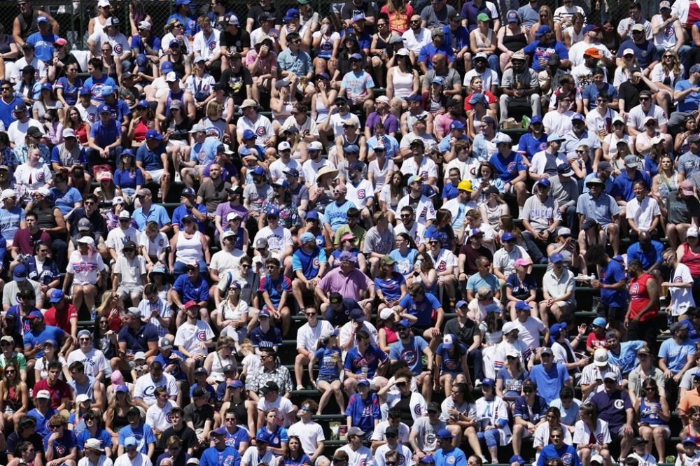 Baseball fans watch the fourth inning of a baseball game between the Pittsburgh Pirates and the Chicago Cubs in Chicago, Sunday, May 19, 2024. (AP Photo/Nam Y. Huh)