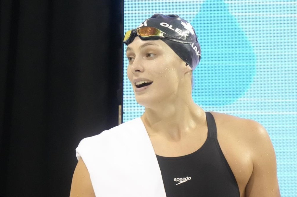 Penny Oleksiak reacts after competing in the 100m freestyle at the Canadian Olympic Swim Trials in Toronto on Friday, May 17, 2024. THE CANADIAN PRESS/Chris Young