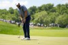 Scottie Scheffler reacts after missing a putt on the fourth hole during the final round of the PGA Championship golf tournament at the Valhalla Golf Club, Sunday, May 19, 2024, in Louisville, Ky. (AP Photo/Jeff Roberson)