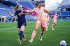Seattle Reign forward Veronica Latsko, left, vies for the ball against Orlando Pride defender Rafaelle, right, during the second half of an NWSL soccer match, Sunday, May 19, 2024, in Seattle. Orlando won 3-2. (AP Photo/Lindsey Wasson)
