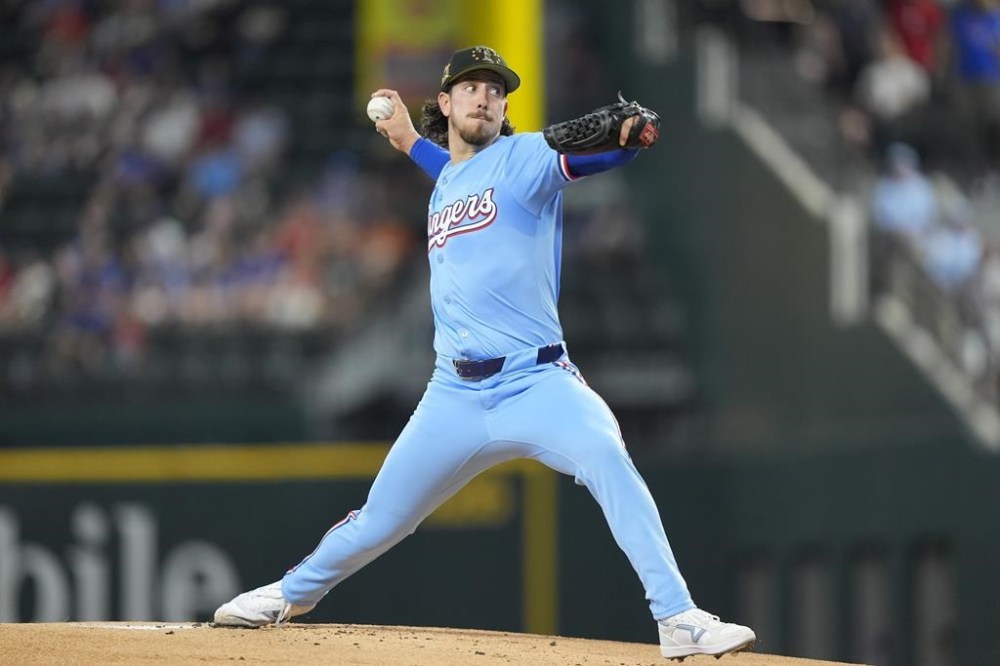Texas Rangers starting pitcher Michael Lorenzen throws during the first inning of a baseball game against the Los Angeles Angels in Arlington, Texas, Sunday, May 19, 2024. (AP Photo/LM Otero)