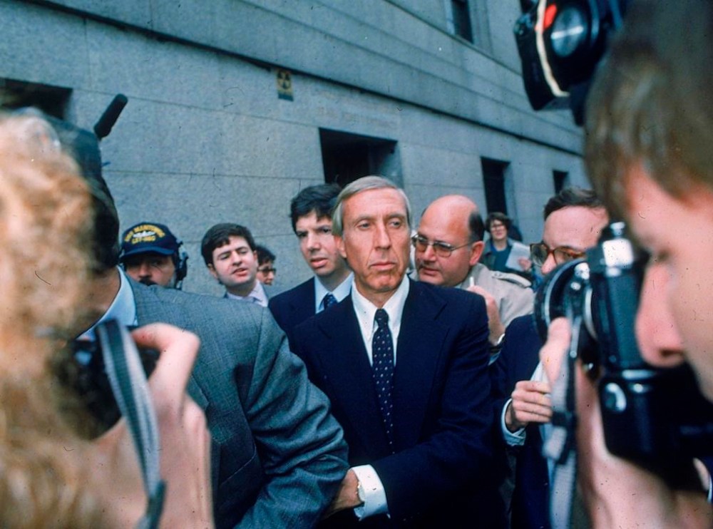 FILE - Ivan F. Boesky, center, leaves federal court in New York, April 24, 1987 after pleading guilty to one count of violating federal securities laws. Boesky, the flamboyant stock speculator whose cooperation with the government cracked open one of the largest insider trading scandals on Wall Street, has died at the age of 87. (AP Photo/G. Paul Burnett, File)