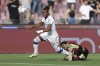 Verona's Tijjani Noslin, left, and Salernitana's Federico Fazio, right, challenge for the ball during the Serie A soccer match between US Salernitana and Hellas Verona in Salerno, Italy, Monday, May 20, 2024. (Alessandro Garofalo/LaPresse via AP)