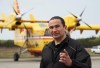 Manitoba Premier Wab Kinew has set the date for a byelection to fill a seat left vacant by former premier Heather Stefanson. Kinew speaks with firefighters at the Flin Flon airport, Tuesday, May 14, 2024. THE CANADIAN PRESS/David Lipnowski