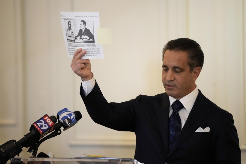 Lawyer Joseph Marrone holds up a photograph during a news conference, Monday, May 20, 2024, in Philadelphia. Marrone is representing the family of the youngest person ever executed in the state of Pennsylvania, Alexander McClay Williams, 16, and suing the county where the Black teenager was convicted in 1931. The suit comes two years after Williams' conviction by an all-white jury was vacated. (AP Photo/Matt Slocum)