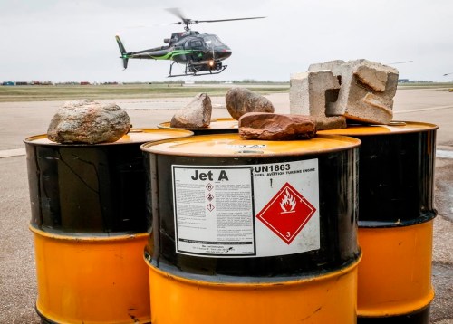 A helicopter lands with crews returning from fighting wildfires near Fort McMurray, Alta., Thursday, May 16, 2024. The mayor of the Northern Rockies Regional Municipality in B.C. says drones are endangering helicopters being used to fight wildfires near Fort Nelson, which was ordered evacuated earlier this month. THE CANADIAN PRESS/Jeff McIntosh
