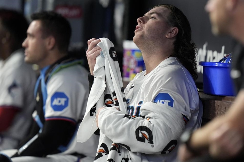 Miami Marlins starter Ryan Weathers towels off in the dugout after pitching during the first inning of a baseball game against the Milwaukee Brewers, Monday, May 20, 2024, in Miami. (AP Photo/Lynne Sladky)