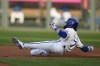 Kansas City Royals' Bobby Witt Jr. slides to second after hitting a double during the first inning of a baseball game against the Detroit Tigers Monday, May 20, 2024, in Kansas City, Mo. (AP Photo/Charlie Riedel)