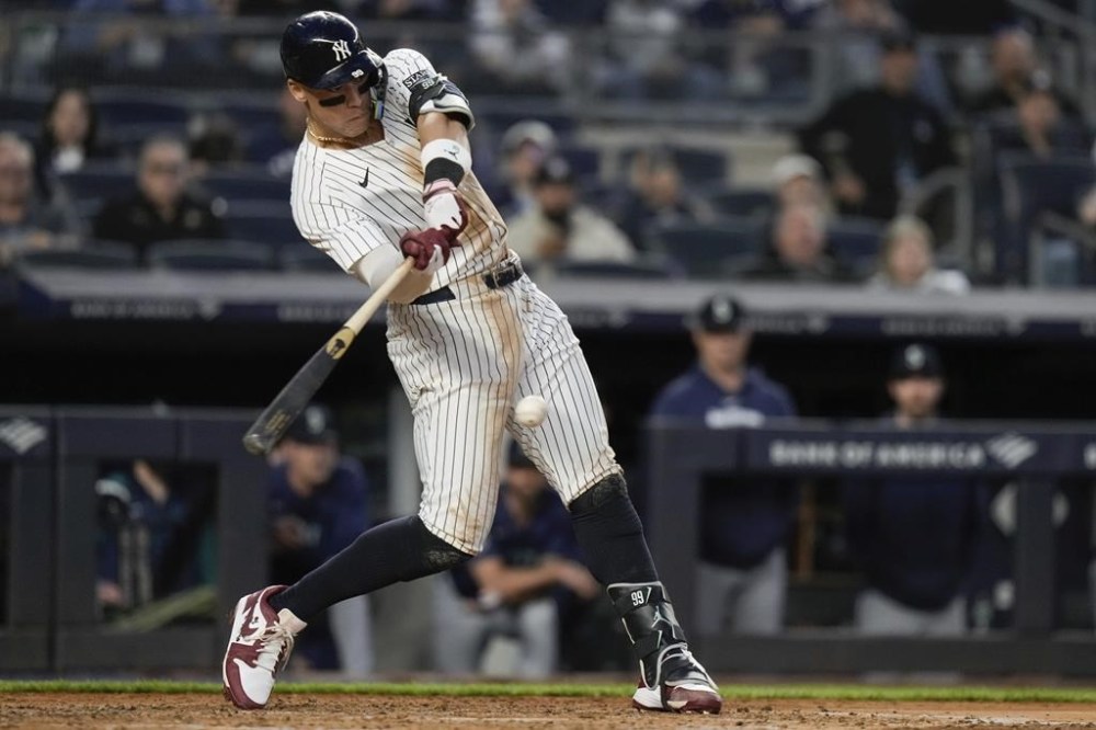 New York Yankees' Aaron Judge hits a single during the fifth inning of a baseball game against the Seattle Mariners, Monday, May 20, 2024, in New York. (AP Photo/Frank Franklin II)