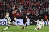 Leverkusen's Josip Stanisic, center, scores a goal during the Europa League second leg semi-final soccer match between Leverkusen and Roma at the BayArena in Leverkusen, Germany, Thursday, May 9, 2024. (Bernd Thissen/dpa via AP)