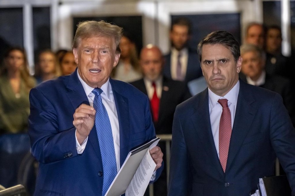 Former President Donald Trump speaks to the media, alongside attorney Todd Blanche, following the day's proceedings at his hush money trial, in New York, Monday, May 20, 2024. (Mark Peterson/New York Magazine via AP, Pool)