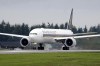 A Singapore Airlines Boeing 777-312ER readies to take off from Paine Field Tuesday, Sept. 17, 2013, in Everett, Wash. Singapore Airlines said on Tuesday, May 21, 2024, a person died aboard and others were injured when a London-Singapore flight encountered severe turbulence. (AP Photo/Elaine Thompson)