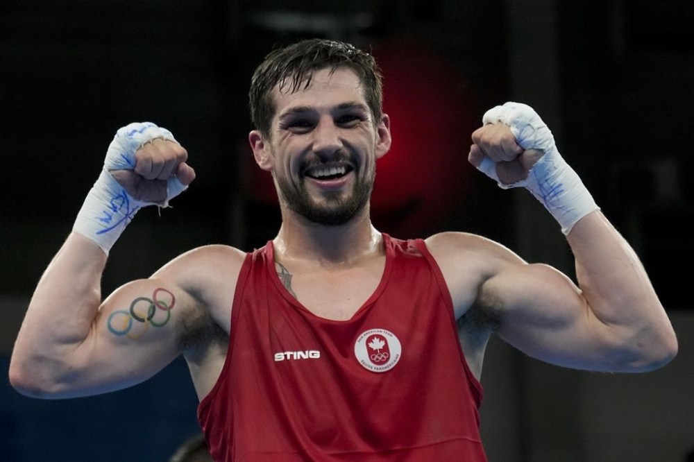 Canada's Wyatt Sanford celebrates after beating Mexico's Miguel Martinez in the men's 63.5kg gold medal bout, at the Pan American Games in Santiago, Chile, Friday, Oct. 27, 2023. Bantamweight Scarlett Delgado leads a team of nine Canadian boxers trying to fight their way into this summer's Paris Olympic field at a last-ditch World Qualification Tournament in Bangkok. Canada has already qualified two boxers for Paris, which features 13 weight classes — seven for men and six for women. THE CANADIAN PRESS/AP/Martin Mejia