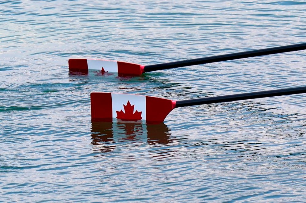 The maple leaf adorns the oars of Canada's Jill Moffatt and Jennifer Casson's boat before they compete in the women's lightweight double sculls rowing final event during the Tokyo Summer Olympic Games in Tokyo on Wednesday, July 28, 2021. THE CANADIAN PRESS/Adrian Wyld