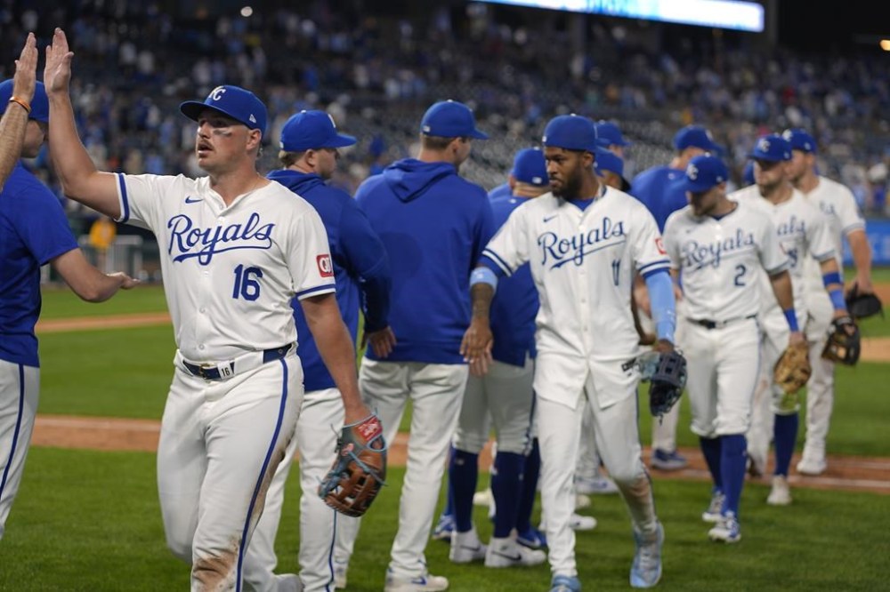 Kansas City Royals' Hunter Renfroe (16) celebrates with teammates after their baseball game against the Detroit Tigers Tuesday, May 21, 2024, in Kansas City, Mo. The Royals won 10-3. (AP Photo/Charlie Riedel)