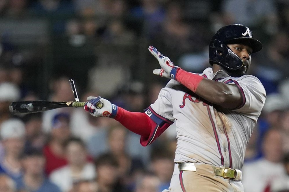 Atlanta Braves' Michael Harris II breaks his bat on a hit during the seventh inning of a baseball game against the Chicago Cubs, Tuesday, May 21, 2024, in Chicago. (AP Photo/Erin Hooley)