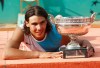 FILE - Spain's Rafael Nadal poses with the cup after defeating Switzerland's Roger Federer during the men's final match of the French Open tennis tournament at Roland Garros stadium in Paris, Sunday, June 10, 2007. Nadal won 6-3, 4-6, 6-3, 6-4. (AP Photo/Michel Spingler, File)