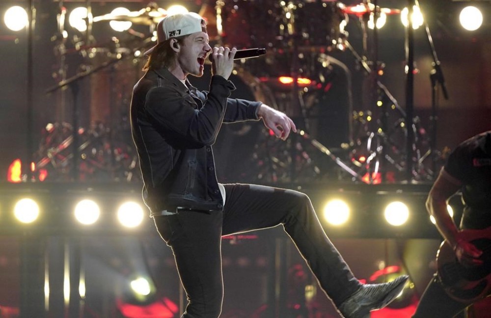 FILE - Morgan Wallen performs during the 56th annual CMA Awards, Nov. 9, 2022, at the in Nashville, Tenn. On Tuesday, May 21, 2024, Nashville councilmembers rejected plans for a glowing sign at Wallen's new bar along the city's neon-lit strip of honky tonks, citing his use of a racial slur publicized in 2021 and his recent criminal charges of throwing a chair off a rooftop and nearly hitting two police officers. (AP Photo/Mark Humphrey, File)