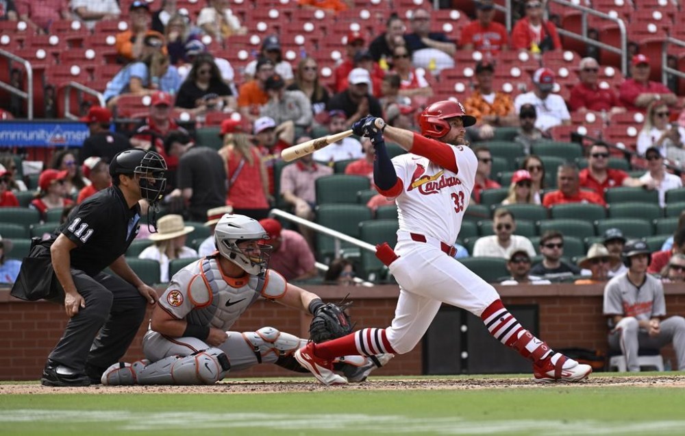 St. Louis Cardinals' Brendan Donovan (33) watches his three-run double against the Baltimore Orioles during the sixth inning of a baseball game Wednesday, May 22, 2024, in St. Louis. (AP Photo/Jeff Le)